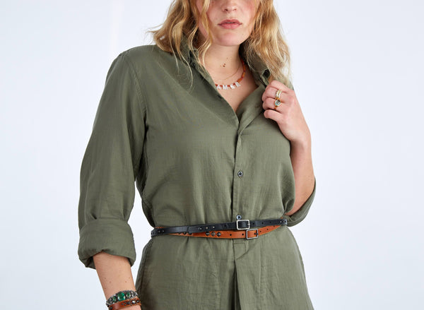 Style 013: Thin belt on tan leather with small, repeating pyramid studs