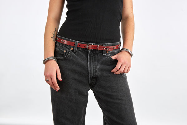 Style 017: Thin belt on cherry leather with elongated ovals, round studs and black crystals