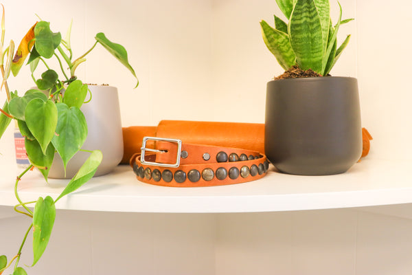 New Studio Belt 404. Honey colored leather with gunmetal bottlecaps. Size 34 only.