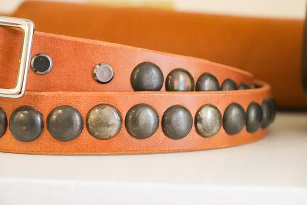 New Studio Belt 404. Honey colored leather with gunmetal bottlecaps. Size 34 only.