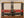New Studio Belt 407. Wide black belt with red, black and turquoise stones. Size 33 only.