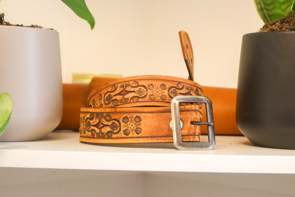 Vintage Studio Belt 62. Natural color with fleur-de-lis tooling. Size 28 only.