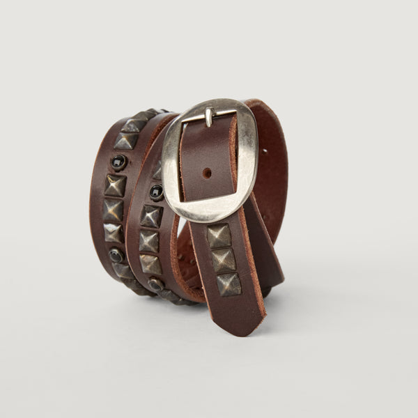 Style 015: Repeating pyramid studs and polished black stones on an Espresso belt