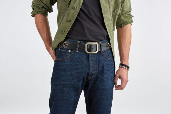 Style 011: Black belt with a repeating pattern of pyramid studs and hole punches