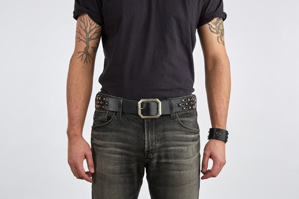 Style 011: Black belt with a repeating pattern of pyramid studs and hole punches